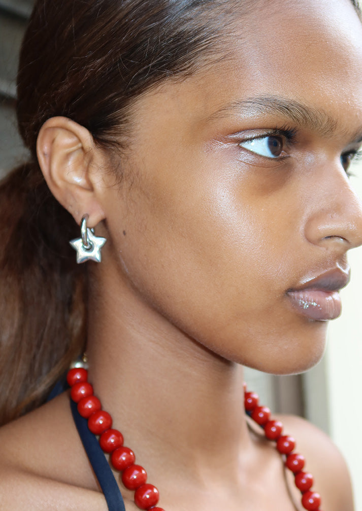 STAR HUGGIE EARRINGS- SILVER